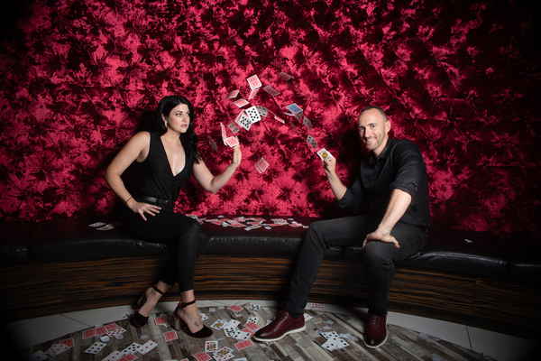 A husband and wife magic duo posing for promotional pictures | Altus Entertainment